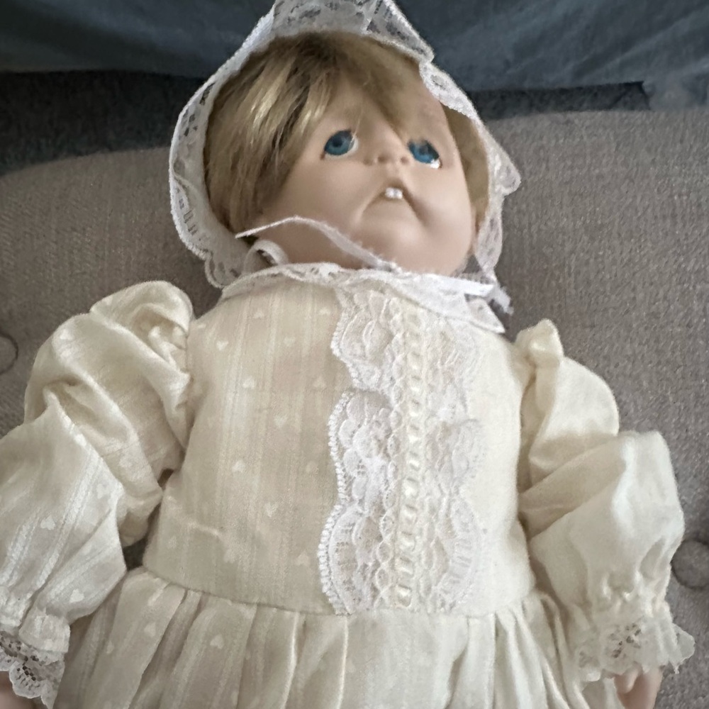 Vintage Porcelain baby doll with homemade clothes.